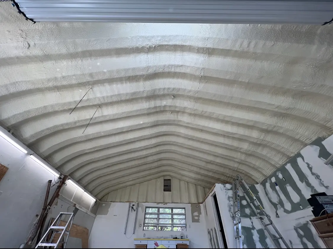 Spray polyurethane foam applied to the underside of a metal roof deck in Lindale